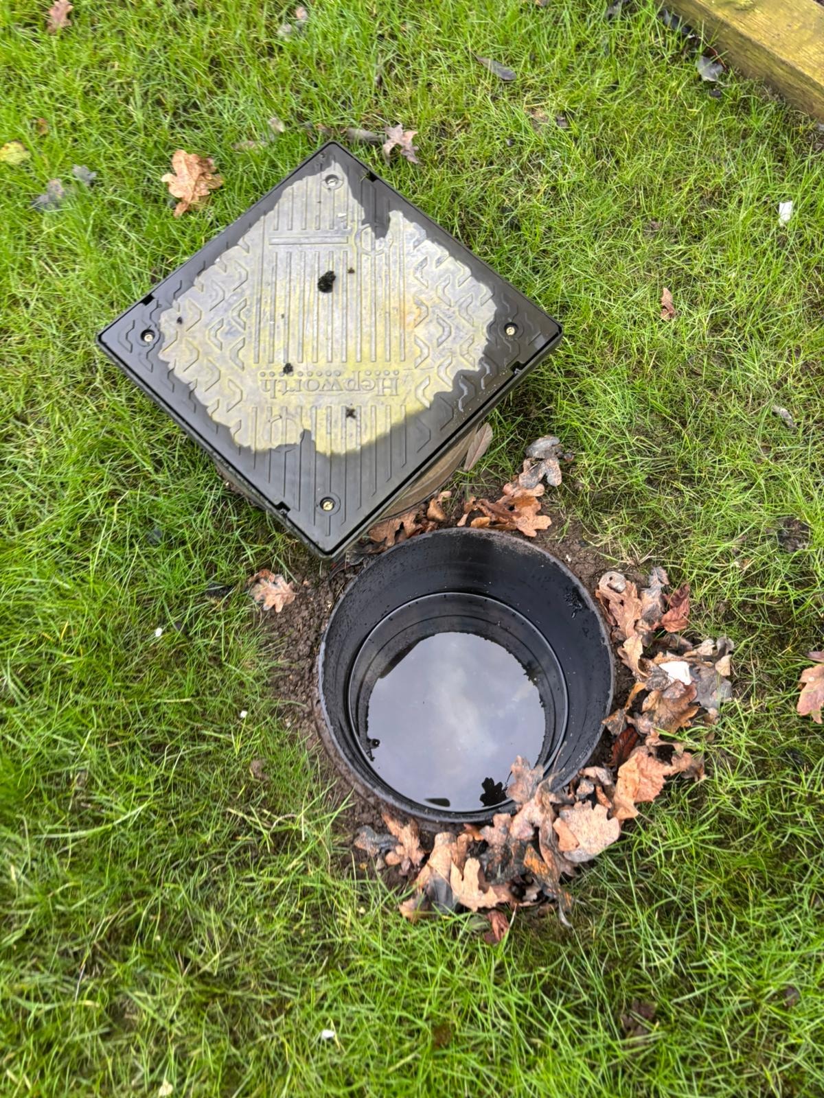 Professional drainage technician at work